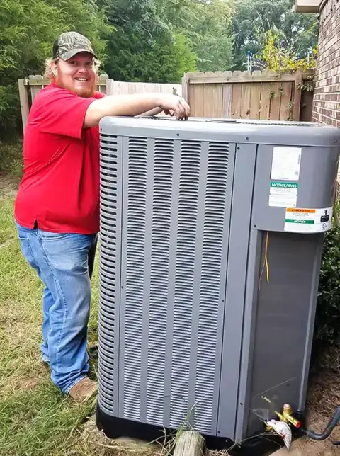 One of our technicians after a successful HVAC repair